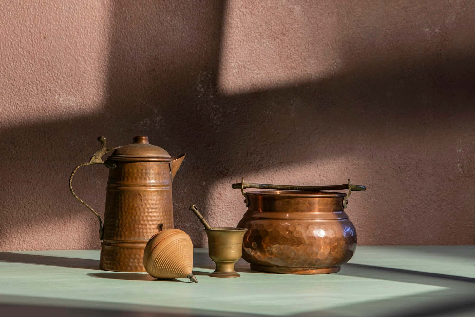 Copper pots and pans on a stove